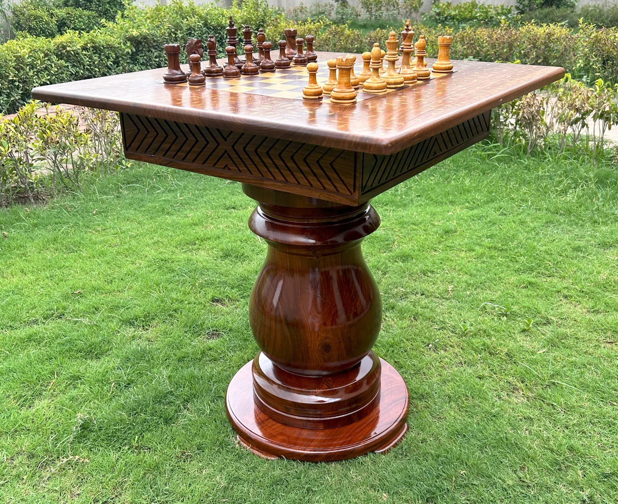 Giant wooden chess pieces with polished finish